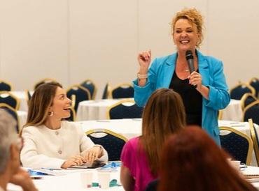 Jane Riley speaking on stage